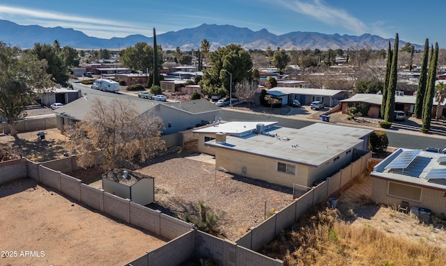 birds eye view of property with a mountain view