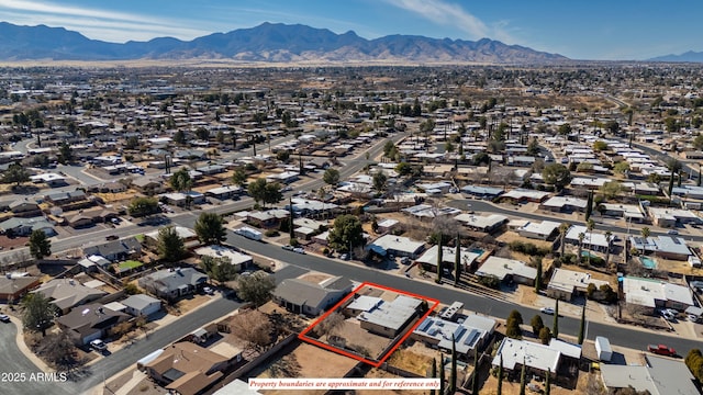 birds eye view of property featuring a mountain view