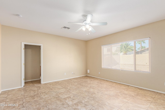 empty room featuring ceiling fan