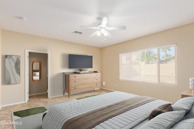 bedroom with light tile patterned floors and ceiling fan