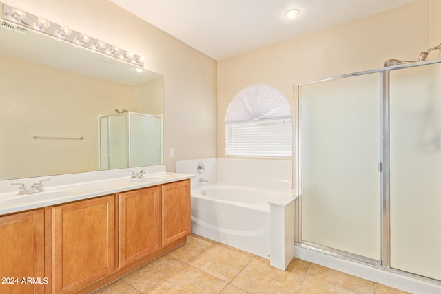 bathroom featuring independent shower and bath, tile patterned flooring, and vanity