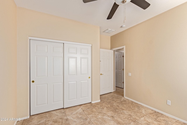 unfurnished bedroom with a closet and ceiling fan