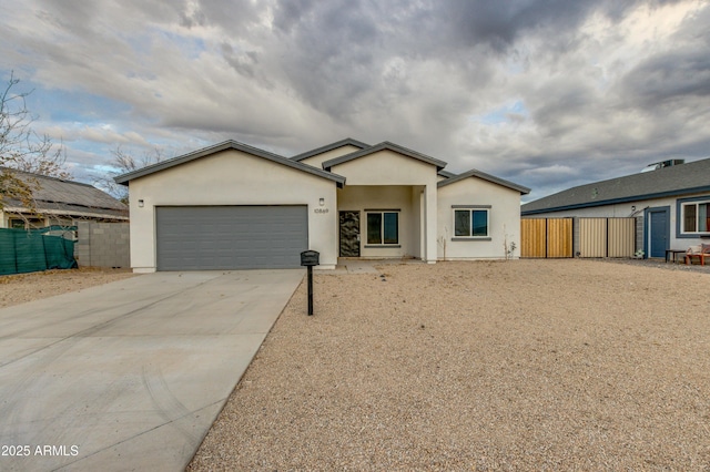 ranch-style home featuring a garage