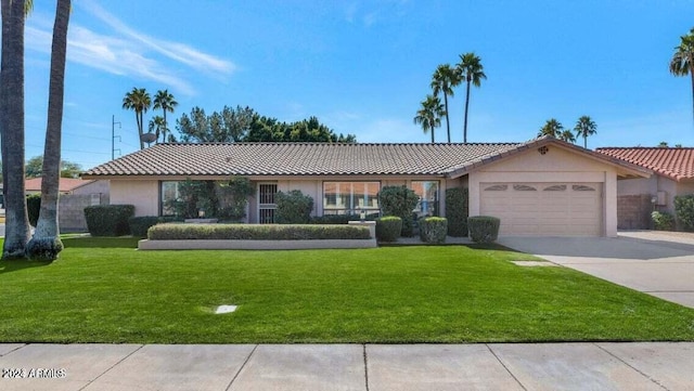 single story home featuring a front lawn and a garage