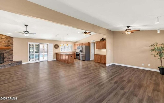 unfurnished living room with a fireplace, vaulted ceiling with beams, and dark wood-type flooring