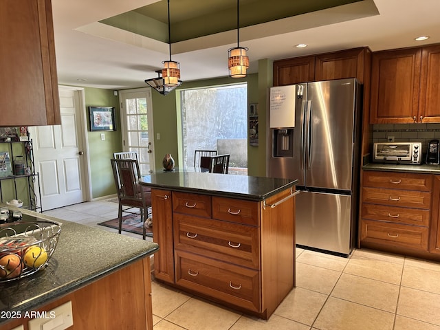 4856 E Cheryl Dr, Paradise Valley, AZ 85253 - kitchen with stainless steel refrigerator with ice dispenser, a tray ceiling, light tile patterned flooring, and recessed lighting