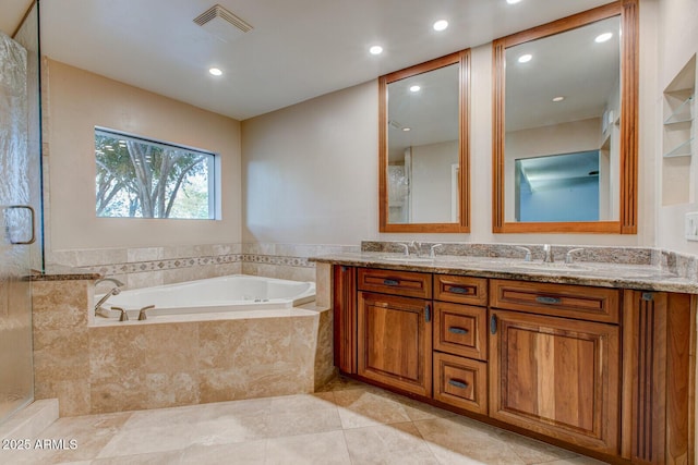 4856 E Cheryl Dr, Paradise Valley, AZ 85253 - full bath featuring a garden tub, double vanity, recessed lighting, a shower stall, and tile patterned floors