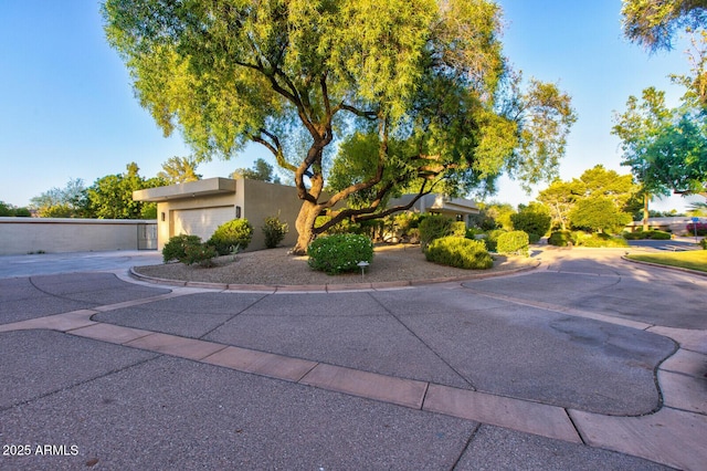 4856 E Cheryl Dr, Paradise Valley, AZ 85253 - view of front of house with an attached garage, stucco siding, and driveway