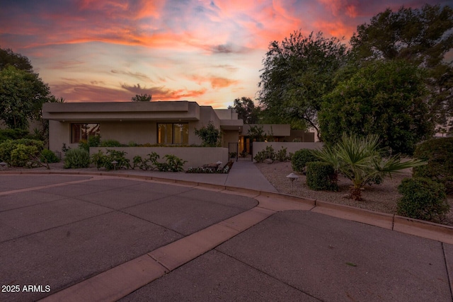 4856 E Cheryl Dr, Paradise Valley, AZ 85253 - view of front of house featuring a fenced front yard, stucco siding, and a gate