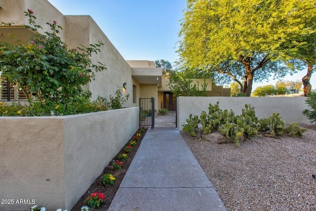 4856 E Cheryl Dr, Paradise Valley, AZ 85253 - doorway to property with a gate and stucco siding