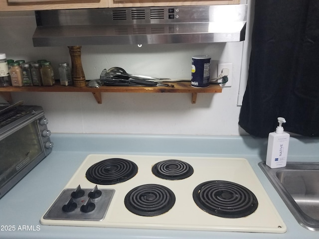 1226 N Mckinley Ave, Ajo, AZ 85321 - kitchen view of stove and extractor fan