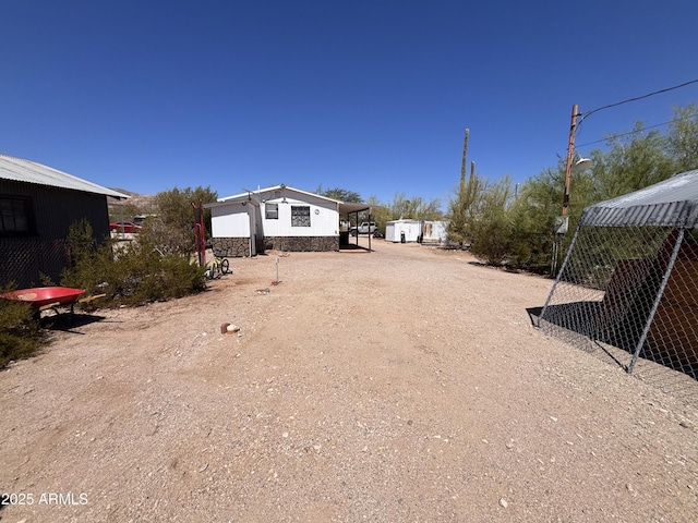 1226 N Mckinley Ave, Ajo, AZ 85321 - view of yard with an outdoor structure and dirt driveway