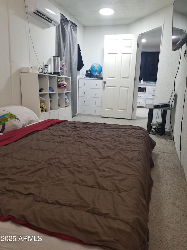 1226 N Mckinley Ave, Ajo, AZ 85321 - bedroom with a wall mounted air conditioner and carpet floors