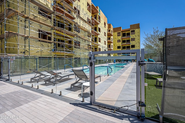 view of pool featuring a patio area