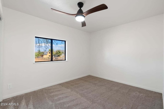 unfurnished room featuring carpet and ceiling fan