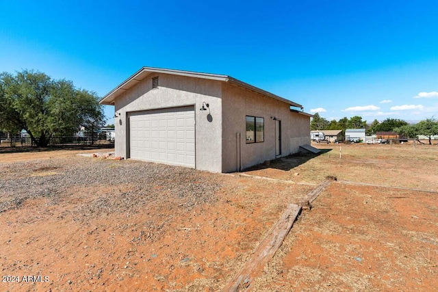 view of side of property with a garage