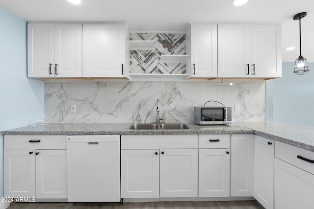 kitchen with white cabinets, white dishwasher, hanging light fixtures, and sink