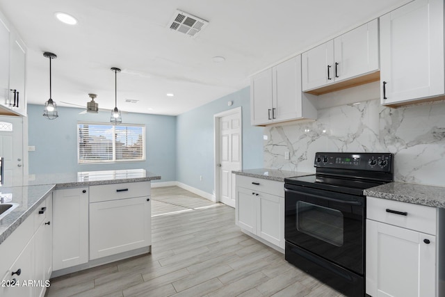 kitchen with light hardwood / wood-style floors, black range with electric stovetop, tasteful backsplash, white cabinets, and decorative light fixtures