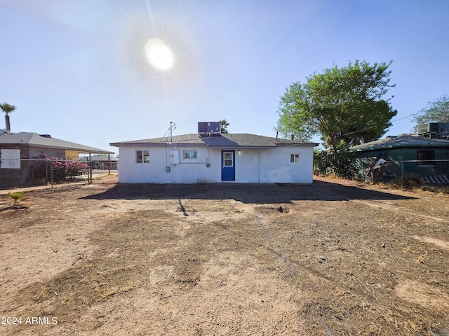 back of property with cooling unit