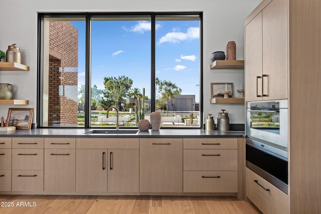 7341 E Sunnyside Dr, Scottsdale, AZ 85260 - kitchen featuring open shelves, light brown cabinets, a sink, and wall oven