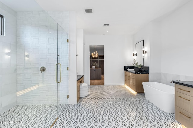 7341 E Sunnyside Dr, Scottsdale, AZ 85260 - full bathroom featuring vanity, a stall shower, and a freestanding tub