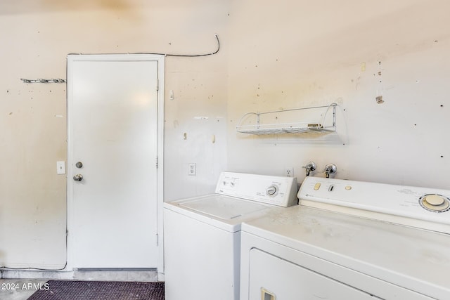 laundry room with washer and dryer and laundry area