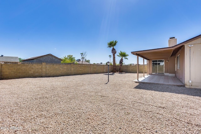 view of yard featuring a patio area and a fenced backyard