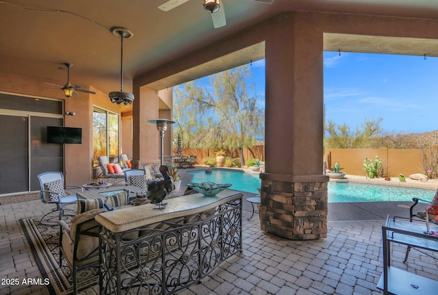 view of patio with a fenced backyard, a fenced in pool, a ceiling fan, and outdoor dining space