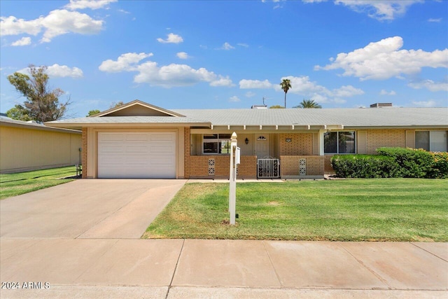 ranch-style home with a front yard, a garage, and cooling unit