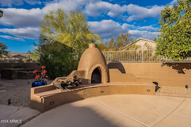 view of patio / terrace with exterior fireplace