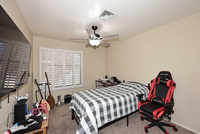 bedroom with ceiling fan and carpet floors