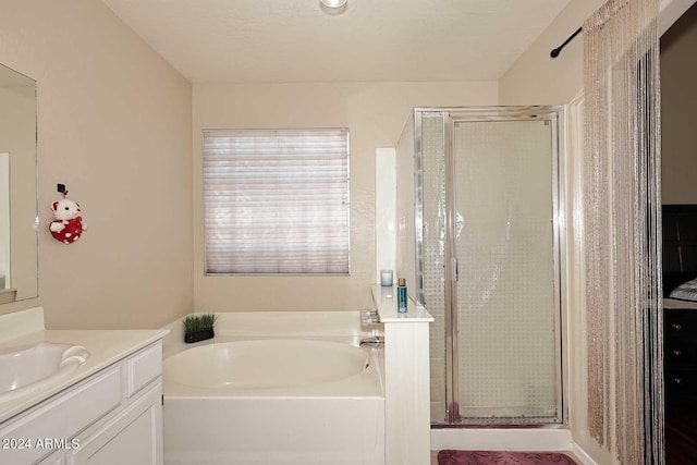 bathroom featuring vanity and plus walk in shower