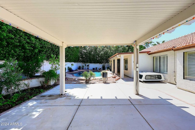 view of patio featuring a fenced in pool