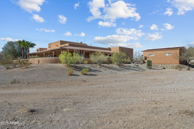 adobe home with stucco siding