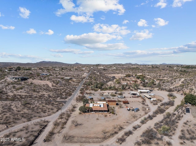 aerial view with a mountain view and view of desert