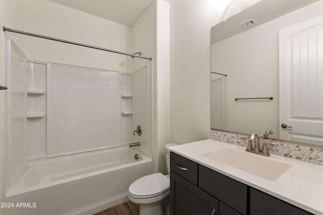 full bath featuring visible vents, toilet, wood finished floors, tub / shower combination, and vanity