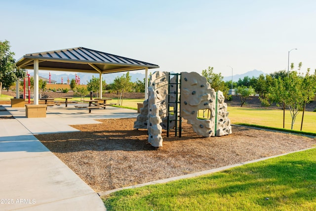 community play area featuring a gazebo and a lawn