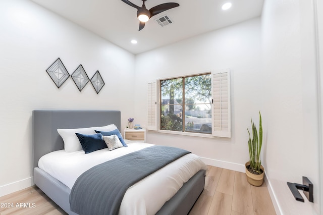 bedroom featuring light hardwood / wood-style flooring and ceiling fan