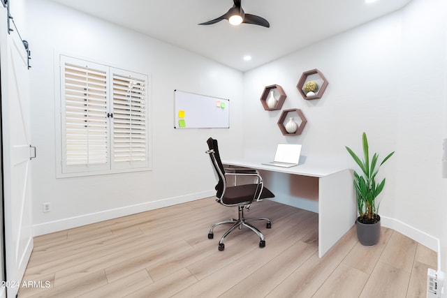 office space with ceiling fan and light hardwood / wood-style flooring