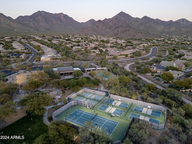 aerial view at dusk featuring a mountain view