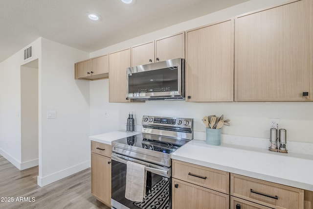 2337 E Contessa St, Mesa, AZ 85213 - kitchen with stainless steel appliances, light brown cabinetry, light countertops, and recessed lighting