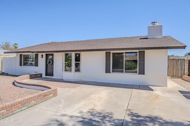2337 E Contessa St, Mesa, AZ 85213 - view of front facade with a chimney, a patio, a shingled roof, and brick siding