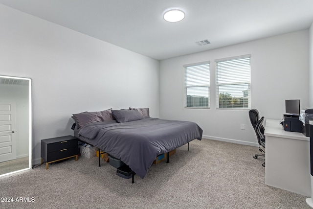 bedroom featuring light colored carpet