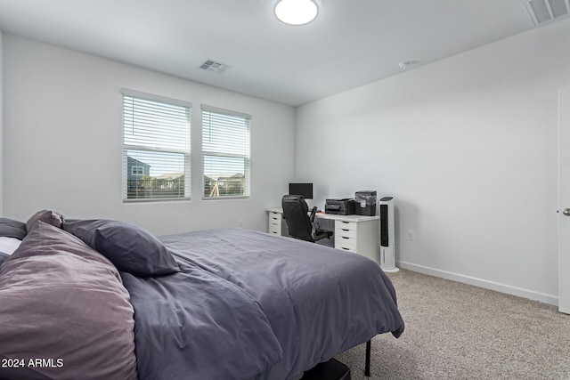 bedroom with light carpet