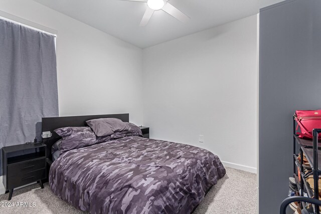 bedroom featuring ceiling fan and light colored carpet