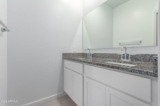 bathroom with tile patterned flooring and vanity