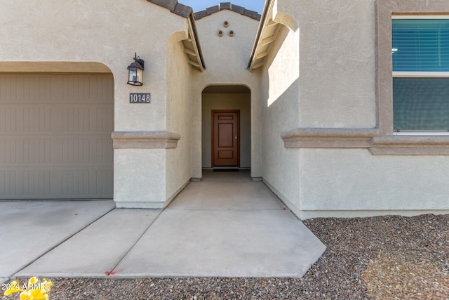 doorway to property featuring a garage