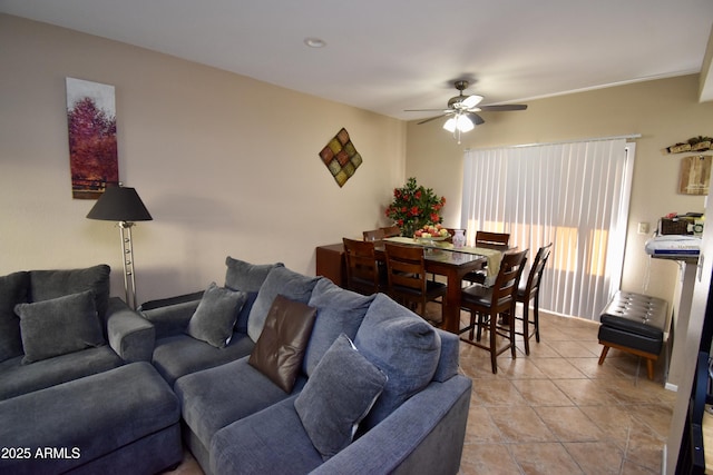 living room featuring a ceiling fan and light tile patterned flooring