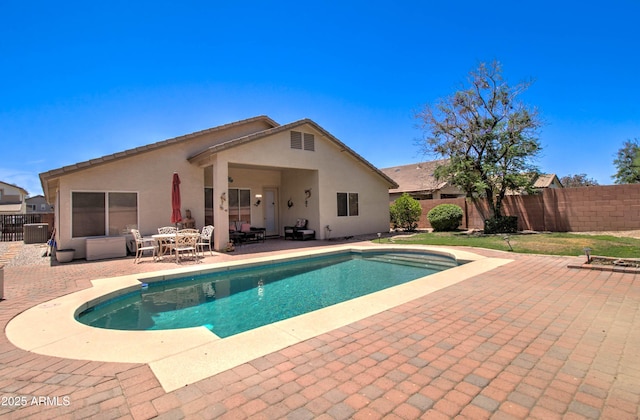 14298 W Amelia Ave, Goodyear, AZ 85395 - view of swimming pool featuring a patio and fence
