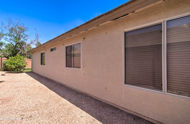 14298 W Amelia Ave, Goodyear, AZ 85395 - view of side of home featuring stucco siding and fence